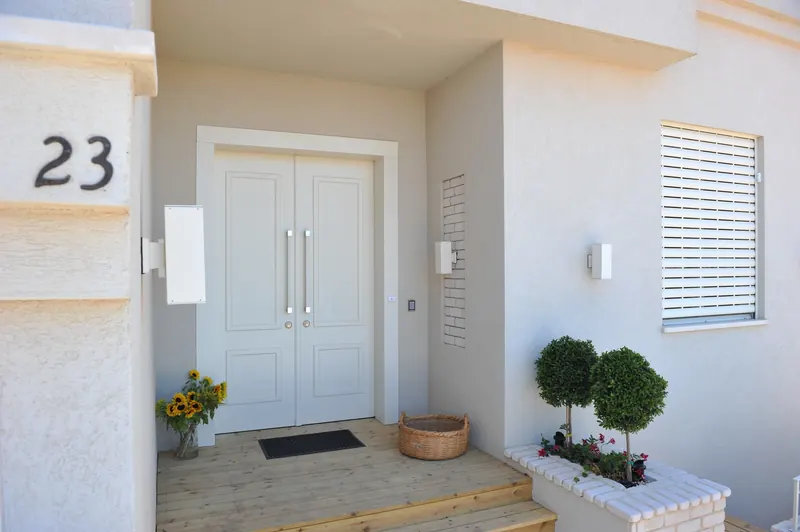 White double doors at a house entrance